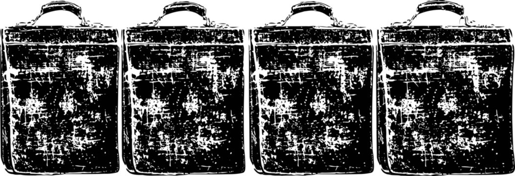 Four old vintage metal suitcases with handles arranged in a row