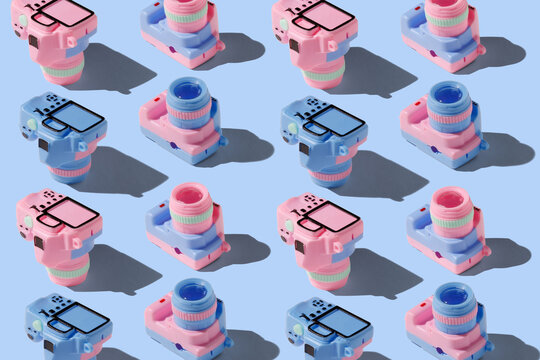 Pattern with SLR camera on pastel color background