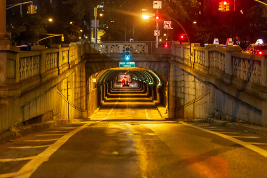 Night one point perspective view of Park Avenue Tunnel in Manhattan, New York City looking north into the tunnel from 33rd Street with little traffic.