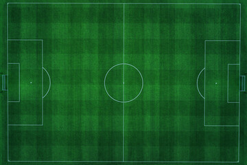 Aerial top-down view of an empty football pitch with vibrant green grass and clear white markings. professional soccer field is perfectly manicured, showing a classic checkered texture for a match. © alones