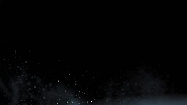 Dynamic splash of water droplets creating a flowing line against a black background