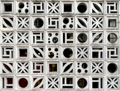 Close up pattern of moulded clay or ceramic latticework, or Roster, in flower pattern. Latticework is a molded or cutout pattern made of clay and ceramic. Finished in white color.