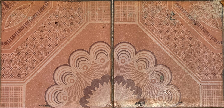 Colonial heritage tiles in random ornate classic swirls and floral diamond medallion in the middle. In red, pink, and peach color. Antique classic and royal tiles. Seamless background texture.