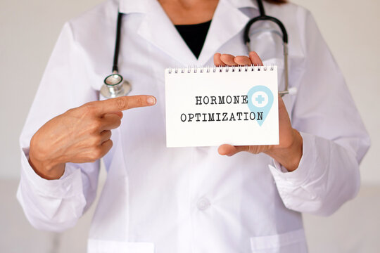 hormone optimization. Healthcare professional showing a digital tablet. Longevity medicine concept.