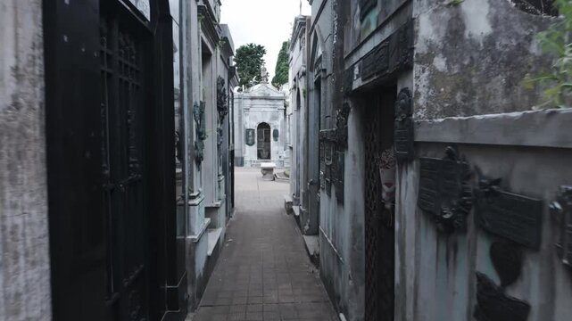 Buenos Aires , Argentina. 15.01.2026 : Narrow hallways of La Recoleta cemetery old stone gravestone buildings 