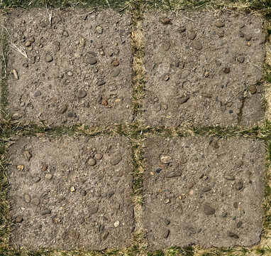 grey rectangular outdoor stone tiles with random shades and roughness. Suitable for exterior garden flooring. Seamless background texture.