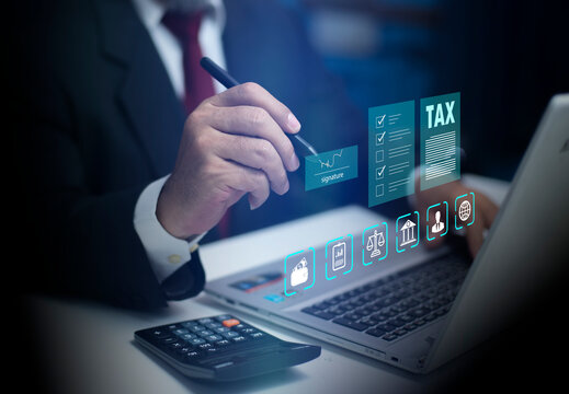 Businessman using laptop to Signing taxes, Fill online personal income tax return for tax payment. Government. State tax. Sign contract and business agreement. Calculation. Paying taxes.