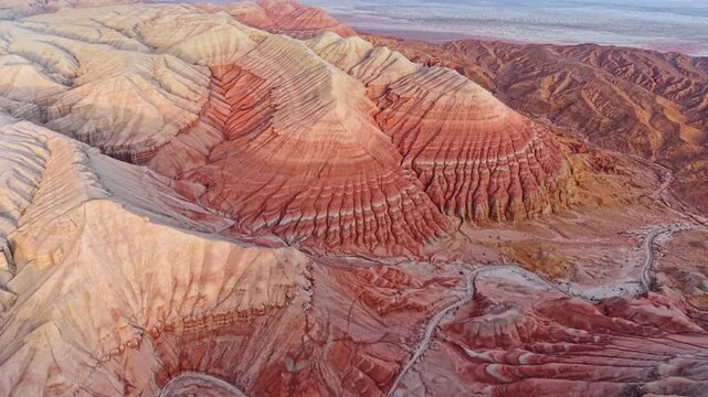 Vivid colorful layered sedimentary mountain with striped geological pattern in Altyn Emel, Kazakhstan