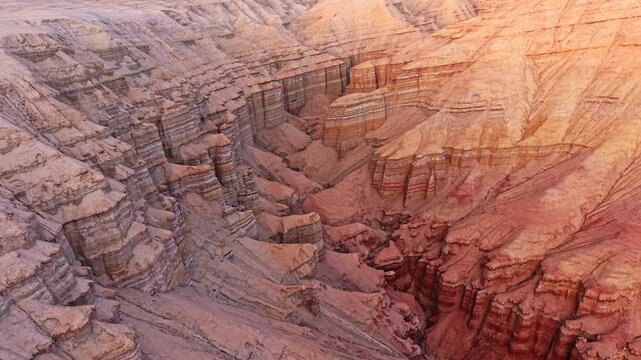 Vivid colorful layered sedimentary mountain with striped geological pattern in Altyn Emel, Kazakhstan