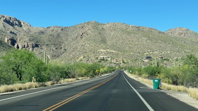 Driving in Arizona desert near Tucson with view of Mount  Lemmon, city dashcam, scenery of the american west	