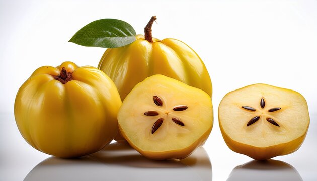 whole and halved ripe yellow star apple fruit with seeds