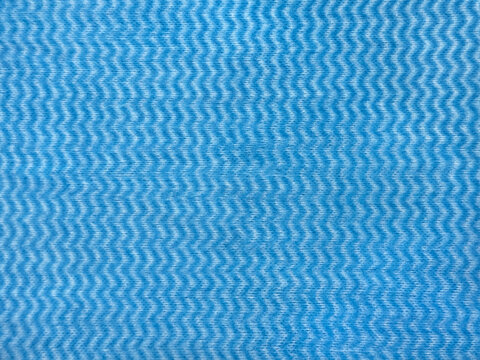 Close up of light blue fabric with 3D chevron or zig zag vertical pattern. Suitable for clothes, textile, wallpaper, upholstery. Seamless background texture.