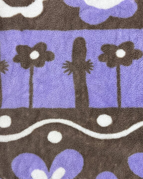 Cute printed illustration in flowers and cactus shape for kids and children fabric. In purple, black, and white color. Suitable for blanket, upholstery, clothes. Seamless background texture.