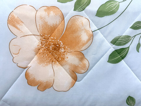 Graphic background of peach orange flower with white color background. Printed wallpaper and fabric concept. Seamless background texture.