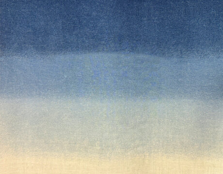 Close up of linen fabric or canvas finished in gradient blue and white color. Suitable for fabric, canvas, upholstery, or wallpaper. Seamless background texture.