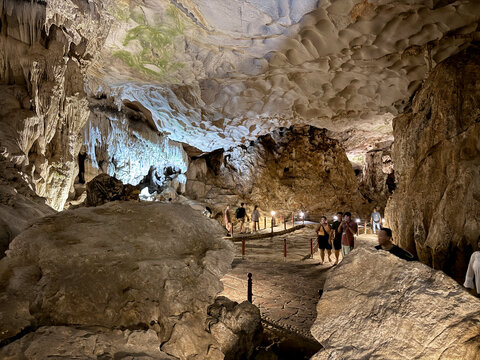 Magnificent cave walls and ceiling texture displaying stalactites and stalagmites with karst and natural limestone rock formations carved by nature.