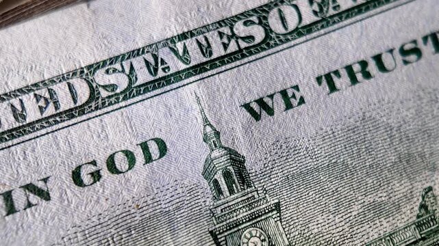 In god we trust us dollar macro money close up united states currency financial trust concept economy cash background