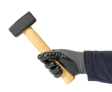 Hand in protective glove holding a sledgehammer isolated on white background ready for demolition or construction work