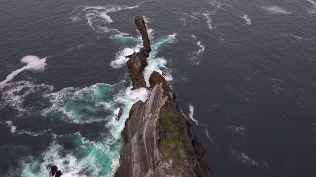 Kerry Cliffs at Cloudy weather Aerial Shot. Dramatic Rocks on the West Ocean Coast in Kerry County, Portmagee, Ireland