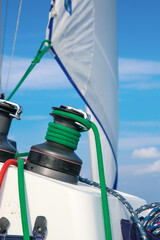 Sailboat Rigging and Green Rope Detail with White Sail © VuVan