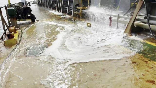 sea water from main fire line's hydrant spraying to the ship deck and move due to rolling of vessel