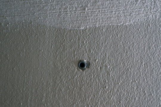 Gray Wall Anchor Inserted in White Wall, Construction Detail and Fixing Concept