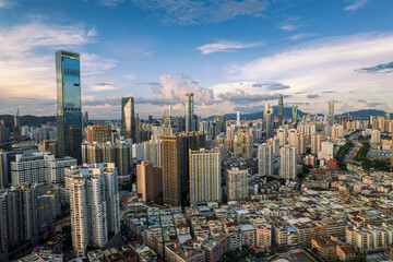 Obraz premium Shenzhen city skyline with modern skyscrapers and dense urban district at sunset