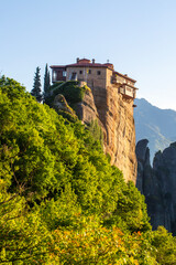 Obraz premium The Rousanou Monastery perched on a steep sandstone cliff in Meteora, Greece
