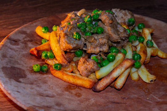 Brasso style saut&eacute;ed pork cubes with garlic and fried potatoes
