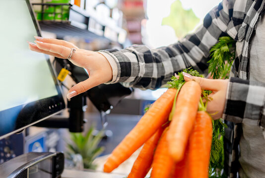 Girl Scanning Items At Self-Checkout