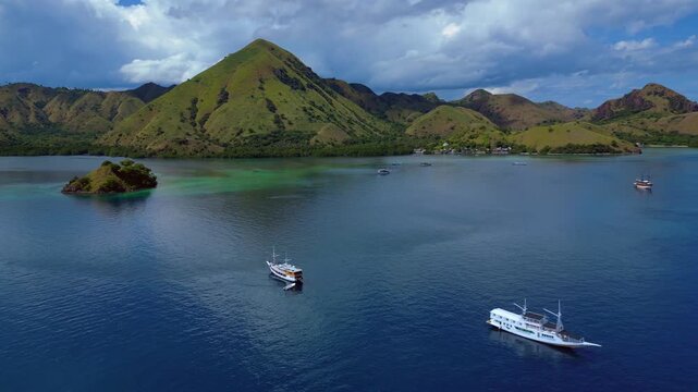 Sailing phinisi boats, pristine tropical paradise. Great aerial view drone