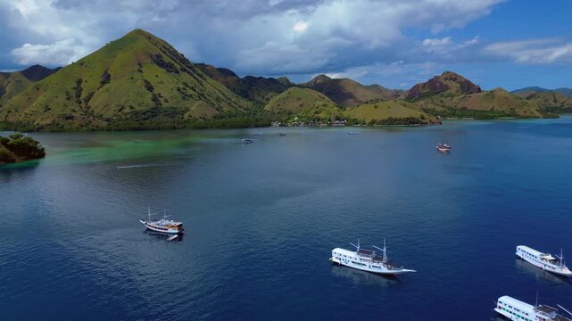 Sailing phinisi boats, pristine tropical paradise. Best aerial view drone