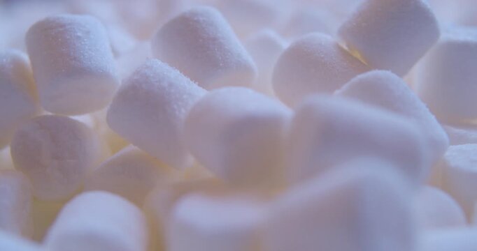 A close-up of  marshmallow pieces.Sweet food. Background