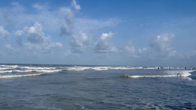 Lots of people on the beach during the summer season. The popular sandy Beach in Cox's Bazar.