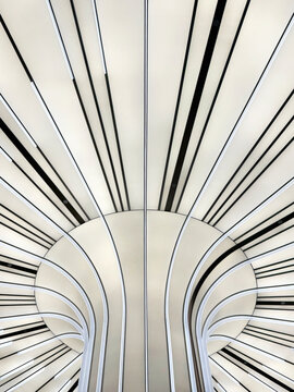 Modern futuristic concept of illuminated panel with sunburst pattern in black and white color. Tilted black and white lines. Ceiling and wall design. Interior design, seamless background texture.