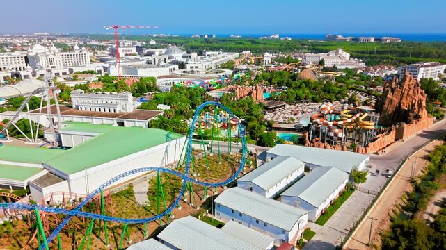 Drone aerial of The Land of Legends Theme Park, Belek, Antalya, Turkey. Roller coaster track and themed area viewed from above near the main complex.