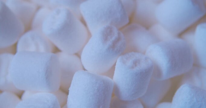 A close-up of  marshmallow pieces.Sweet food. Background