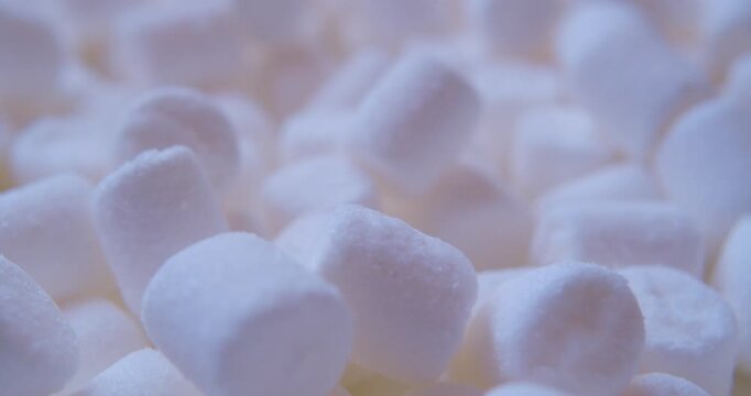 Close-up of many pieces of White Marshmallow. Sweet food. Macro with shallow depth of field.