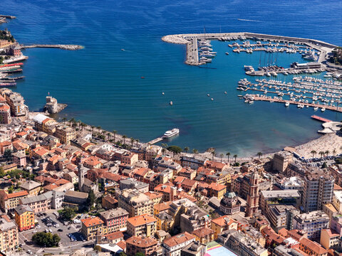 Aerial view of the harbor and colorful historic buildings along the coastline in Rapallo, Liguria, Italy.