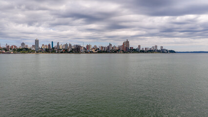 Obraz premium Aerial panorama of Posadas waterfront skyline along the Parana River, Misiones Argentina.
