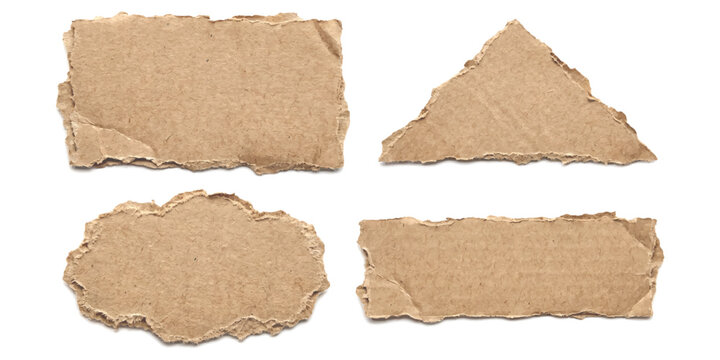 Set of four torn pieces of brown cardboard paper with rough edges
