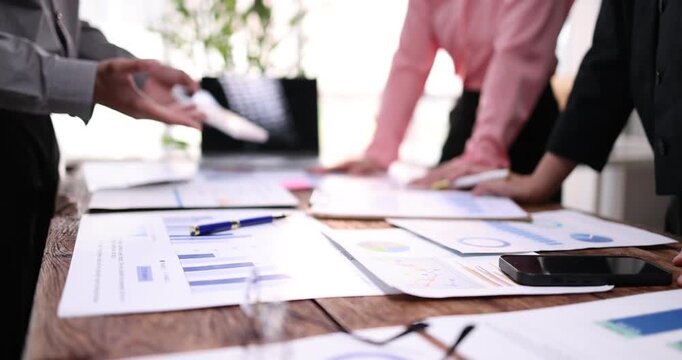 Business team working at office, using calculator to calculate company finance, accounting with laptop computer on table, budget management. Doing finance, budgeting and tax calculation