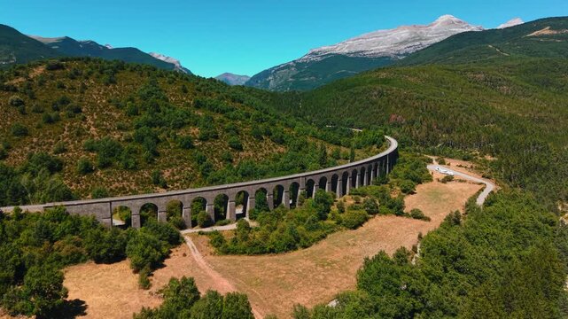 Scenic aerial view of old canfranc railway viaduct in the pyrenees mountains