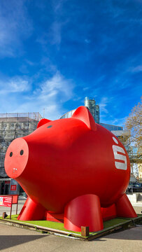 Ludwigsburg, Germany - March 2, 2025. Side view of the biggest red piggy bank in the world of German Savings Bank Kreissparkasse Ludwigsburg. Guinness World Records statue.