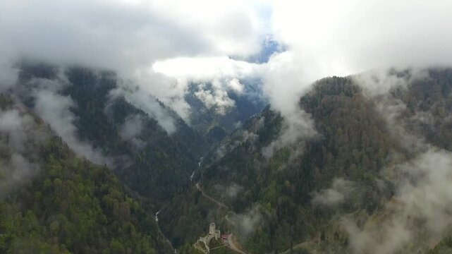 Aerial Firtina Valley in Rize Turkey above clouds, lush forested mountains and storm river. Misty canyon corridor, Pontic skyline, humid greenery, Black Sea highlands, dramatic nature.