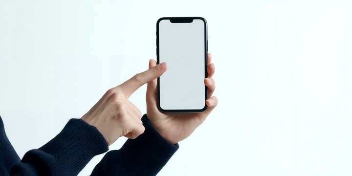 Marketing executive hands holding a smartphone with blank white screen and pointing at the display on white background, concept for app mockup, digital interface and software demo