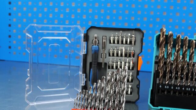 A set of metal bits for installation work in a plastic case.A set of drills for drilling metal in a plastic case.