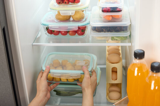 Organizing fresh food in airtight containers inside a refrigerator