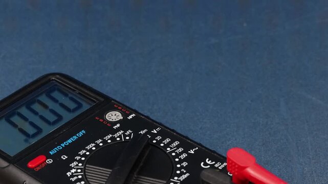 A digital multimeter for measuring the parameters of electrical circuits. Close-up. Soft focus.