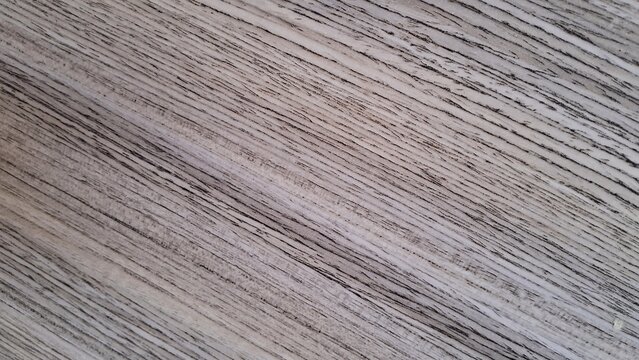 Light grey wood grain texture showing natural parallel lines on a rustic floor surface pattern